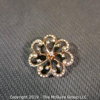 Jewelry:  Vintage floral motif, 14K. Seed pearl,  3 point center diamond brooch, 24 mm diameter; 2.9 grams (TMG 777)