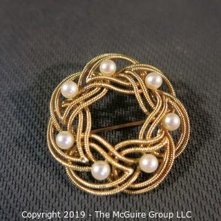 Jewelry: Double woven strands, 14K circle brooch (1.5 in.) with 8 pinkish white pearls at 4.5mm, 10.8 grams total weight (TMG 731)