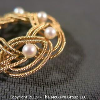 Jewelry: Double woven strands, 14K circle brooch (1.5 in.) with 8 pinkish white pearls at 4.5mm, 10.8 grams total weight (TMG 731)