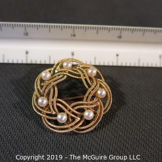 Jewelry: Double woven strands, 14K circle brooch (1.5 in.) with 8 pinkish white pearls at 4.5mm, 10.8 grams total weight (TMG 731)