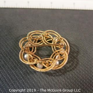 Jewelry: Double woven strands, 14K circle brooch (1.5 in.) with 8 pinkish white pearls at 4.5mm, 10.8 grams total weight (TMG 731)