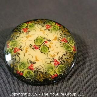 Jewelry: Russian Lacquer 2 in. round brooch (1998), Holly decoration in red, green antique white with black border. 