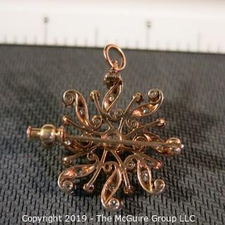 Jewelry: Rose gold (14K) Diamond Brooch with fold down locket bail, Floral motif, center diamond .50 ct and 1.45 ctw.  Diamonds are eye-clean, bright white (G color); 6.5 grams total weight (TMG 778)