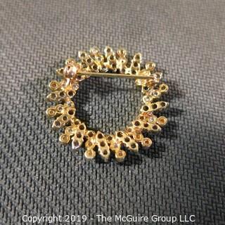 Jewelry: Two 14K Yellow gold diamond and sapphire circle pins.