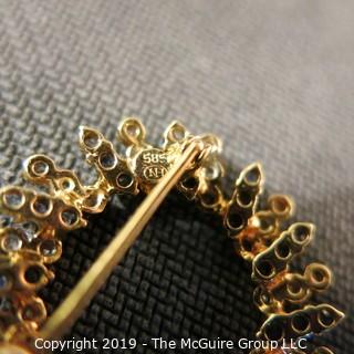 Jewelry: Two 14K Yellow gold diamond and sapphire circle pins.