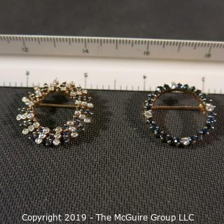 Jewelry: Two 14K Yellow gold diamond and sapphire circle pins.