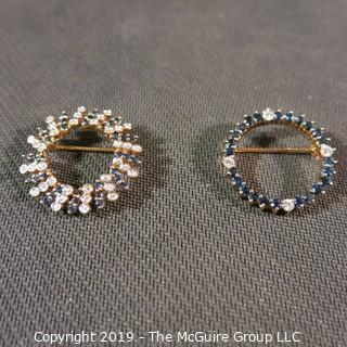 Jewelry: Two 14K Yellow gold diamond and sapphire circle pins.