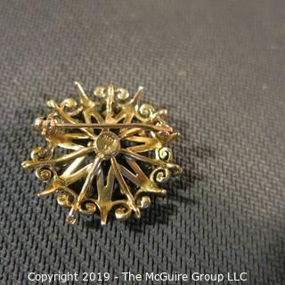 Jewelry: Vintage 14K garnet brooch, star inside an ornate circle, measuring 26.5 mm; 5.7 grams total weight; (TMG 774) 