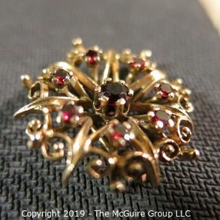 Jewelry: Vintage 14K garnet brooch, star inside an ornate circle, measuring 26.5 mm; 5.7 grams total weight; (TMG 774) 