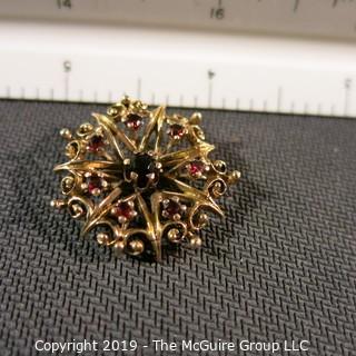 Jewelry: Vintage 14K garnet brooch, star inside an ornate circle, measuring 26.5 mm; 5.7 grams total weight; (TMG 774) 