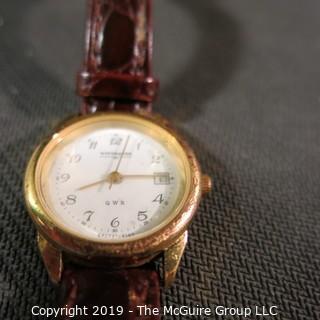 Jewelry: Ladies Wittnauer water resistant wristwatch, 1 in. round face, date, 7.5 in. brown leather band. 