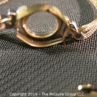 Jewelry: Ladies Mid-20th Century 14K Yellow gold Elgin watch with diamond accents, 22 x 15mm case with 10K GF braided rope watch band; total weight 11.4 grams 