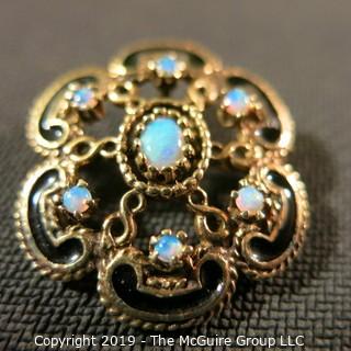 Jewelry:European style, 14K brooch/pendant, 1 X 1¼ in. 6 petal floral motif with opal accents and black enamel outline; 9.9 grams total weight; TMG 787)