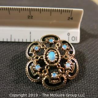 Jewelry:European style, 14K brooch/pendant, 1 X 1¼ in. 6 petal floral motif with opal accents and black enamel outline; 9.9 grams total weight; TMG 787)