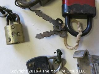 Assortment of vintage padlocks with keys