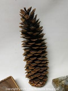 One very large pine cone; marble ash tray, box of buttons and signed ceramic pottery bowl