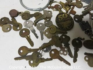 Collection including various types of keys, padlocks, and trinkets