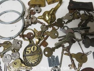 Collection including various types of keys, padlocks, and trinkets