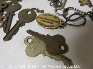 Collection including various types of keys, padlocks, and trinkets