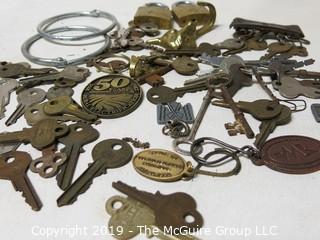 Collection including various types of keys, padlocks, and trinkets