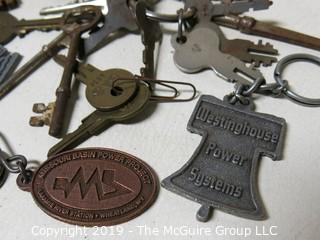 Collection including various types of keys, padlocks, and trinkets