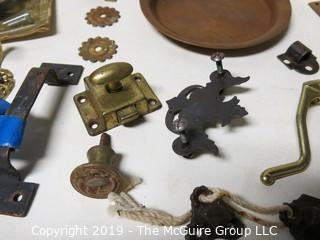 Assortment including M-C Copper Ashtray, denture powder and door hardware  