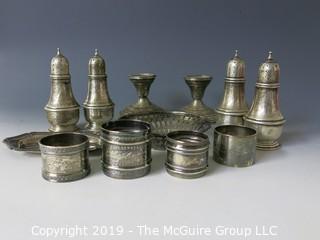 Collectible: Silver: Collection of Sterling including napkin rings, salt and pepper shakers and weighted candlesticks; 650g total weight