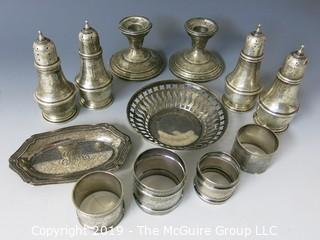 Collectible: Silver: Collection of Sterling including napkin rings, salt and pepper shakers and weighted candlesticks; 650g total weight