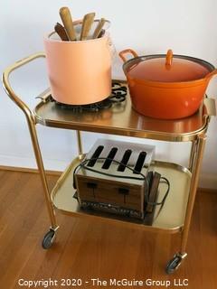 Collection including Chrome Tea Cart, Cast Iron Orange Casserole Pot, Pink Ice Bucket, Vintage Toaster and Misc Utensils 