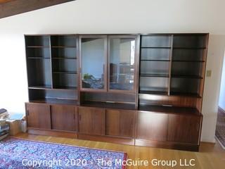 Danish Mid Century Modern (M-C-M) Bookcase with Lower Cabinet Featuring Sliding Doors.  NOTE: THE PHOTO SHOWS THREE (3) SECTIONS SIDE BY SIDE. THIS LOT CONSISTS OF THE MIDDLE, GLASS FRONT SECTION ONLY.   THE LEFT AND RIGHT SECTIONS ARE BEING SOLD AS LOTS 0001A AND 0001B {Each section is 43" wide x 77"tall; lower cabinet is 17" deep, bookcase is 12" deep} 