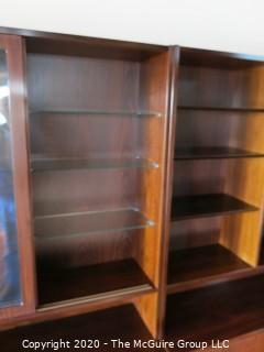 Danish Mid Century Modern (M-C-M) Bookcase with Lower Cabinet Featuring Sliding Doors.  NOTE: THE PHOTO SHOWS THREE (3) SECTIONS SIDE BY SIDE. THIS LOT CONSISTS OF THE MIDDLE, GLASS FRONT SECTION ONLY.   THE LEFT AND RIGHT SECTIONS ARE BEING SOLD AS LOTS 0001A AND 0001B {Each section is 43" wide x 77"tall; lower cabinet is 17" deep, bookcase is 12" deep} 