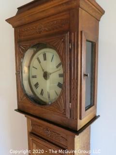 Carved European Oak Grandfather Clock in Case; hand-painted face and handmade movement; 84" tall and 22" wide; untested