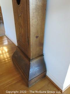 Carved European Oak Grandfather Clock in Case; hand-painted face and handmade movement; 84" tall and 22" wide; untested