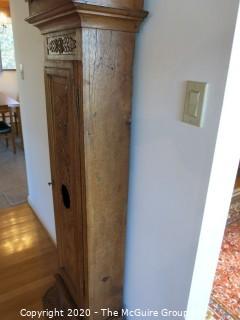 Carved European Oak Grandfather Clock in Case; hand-painted face and handmade movement; 84" tall and 22" wide; untested