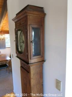 Carved European Oak Grandfather Clock in Case; hand-painted face and handmade movement; 84" tall and 22" wide; untested