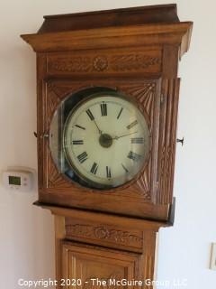 Carved European Oak Grandfather Clock in Case; hand-painted face and handmade movement; 84" tall and 22" wide; untested