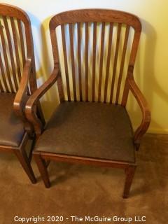 4 European Oak Dining Chairs; 2 with arms; 39 1/2" tall at back x 24" wide at front x 18 1/2" seat height