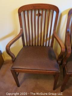 4 European Oak Dining Chairs; 2 with arms; 39 1/2" tall at back x 24" wide at front x 18 1/2" seat height