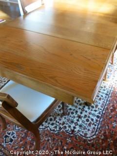 English Oak Dining Table with pull-out end leaves; 40 x 84" with both leaves extended; leaves are each 17 1/2"