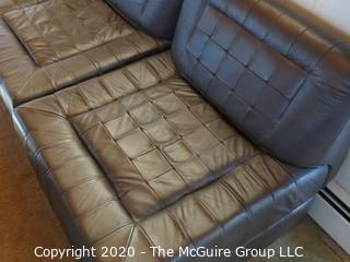 Leather Sectional Seating - NOTE: THIS LOT IS COMPRISED OF (2) LEATHER SECTIONALS AND (2) GLASS-TOP DISPLAY BOXES; LOT 0035B IS COMPRISED OF (2) LEATHER SECTIONALS} each chair sectional is 27" x 30" x 14" tall; shadow boxes are 27 x 27 x 14" tall; ottoman is 27 x 27 x 14" tall 