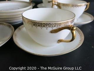 Set of 7 Limoges Porcelain Double Handle Cups and Saucers with 5 additional saucers made by D & C Delinieres & Co. White with Gilt Design. Made in France 