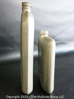 Two Metal Flasks.  Measures approximately 11" and 9" tall.  As is, one missing top.