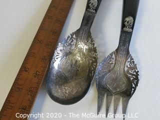 Pair of Silver Plate Serving Fork and Spoon, with Black Handles.  Made in Singapore.  Measures approximately 10" long