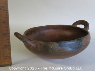 Hand Thrown Double Handle Red Clay Pottery Serving Bowl.  Measures approximately 8" in diameter including handles. Made in Peru. 