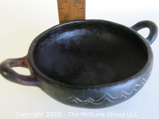 Hand Made Black Clay Bowl with Double Handles. In the style of Barro Negro Pottery of Oaxaca, Mexico. Measures approximately 6 1/2" X 3"