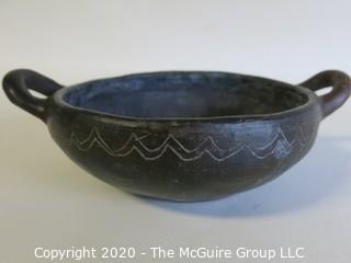 Hand Made Black Clay Bowl with Double Handles. In the style of Barro Negro Pottery of Oaxaca, Mexico. Measures approximately 6 1/2" X 3"