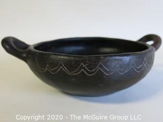 Hand Made Black Clay Bowl with Double Handles. In the style of Barro Negro Pottery of Oaxaca, Mexico. Measures approximately 6 1/2" X 3"