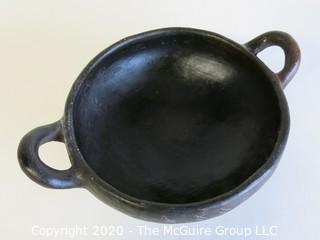 Hand Made Black Clay Bowl with Double Handles. In the style of Barro Negro Pottery of Oaxaca, Mexico. Measures approximately 6 1/2" X 3"