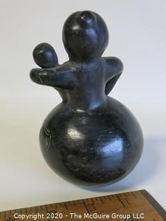 Hand Made Black Clay Pottery Figure of Mother with Child. In the style of Barro Negro Pottery of Oaxaca, Mexico. Measures approximately 3" X 5"