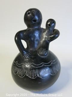 Hand Made Black Clay Pottery Figure of Mother with Child. In the style of Barro Negro Pottery of Oaxaca, Mexico. Measures approximately 3" X 5"